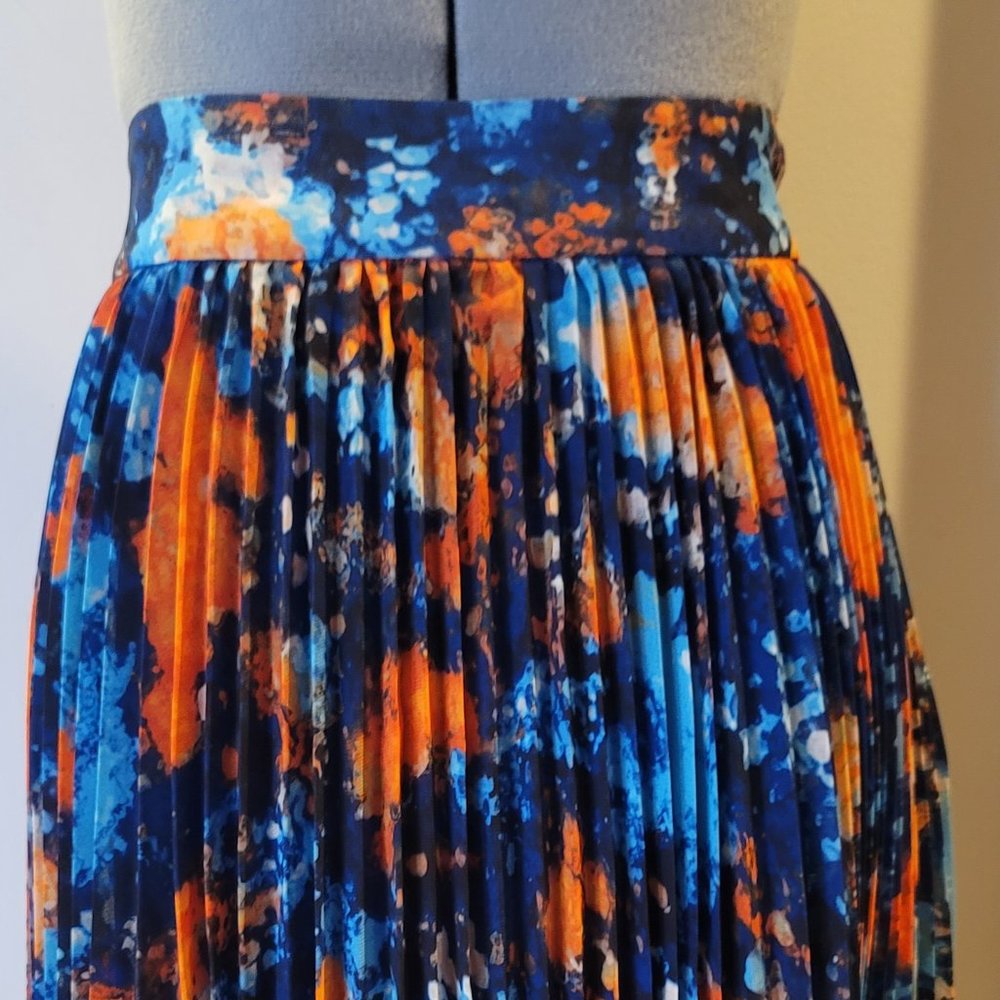 Colorful patterned pleated skirt.